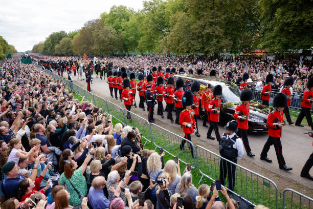 The hearse carrying the coffin of Queen Elizabeth II travels along the Long Walk the Queen's state funeral in Windsor, UK, on Monday, Sept. 19, 2022. The Queen's life is commemorated at her state funeral in Westminster Abbey in London, to be attended by roughly 500 global dignitaries and world leaders including US President Joe Biden. Photographer: Jason Alden/Bloomberg via Getty Images