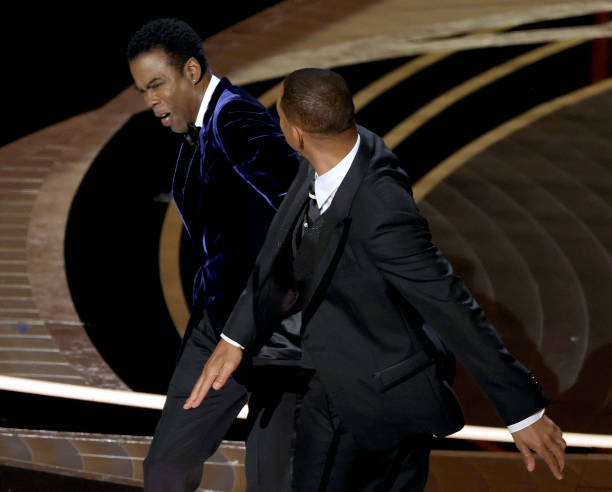 HOLLYWOOD, CALIFORNIA - MARCH 27: Will Smith appears to slap Chris Rock onstage during the 94th Annual Academy Awards at Dolby Theatre on March 27, 2022 in Hollywood, California. (Photo by Neilson Barnard/Getty Images)